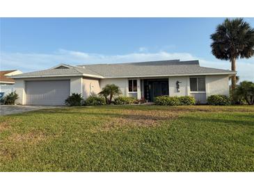 Charming single-story home with a well-maintained lawn, mature landscaping, and a two-car garage at 31 E Sea Harbor, Ormond Beach, FL 32176