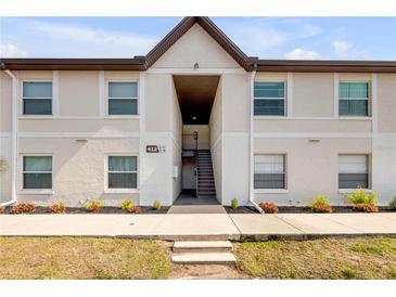 Inviting exterior of a multi-Gathering home with a well-maintained walkway and landscaped yard at 412 Banana Cay Dr # A, South Daytona, FL 32119