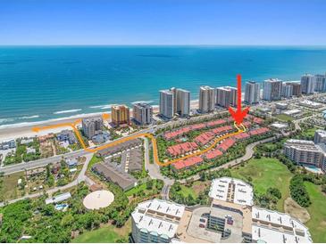 Stunning aerial view of townhomes at the oceans with beach access and nearby amenities at 2961 Oceans Trce, Daytona Beach Shores, FL 32118