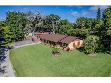Charming single-story home with lush landscaping and well-maintained lawn in a desirable neighborhood at 3048 Mango Tree Dr, Edgewater, FL 32141