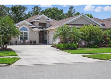 Charming single-story home featuring lush landscaping and a welcoming front entrance at 3378 Leonardo Ln, New Smyrna Beach, FL 32168