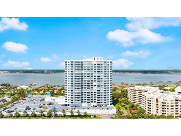 Stunning high-rise condo building featuring waterfront views and a beautiful, clear, sunny sky at 2 Oceans West Blvd # 702, Daytona Beach, FL 32118