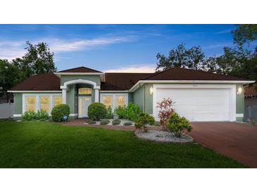 Charming single-story home featuring lush lawn and well-maintained landscaping and neutral paint at 3231 Bretton Woods Ter, Deltona, FL 32725