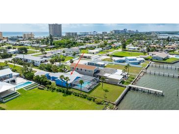 Stunning waterfront home with a private pool, dock, and lush green lawn at 3326 S Peninsula Dr, Port Orange, FL 32127