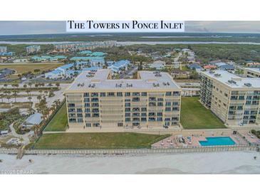 Beachside condominium features a pool, hot tub, lawn, and ocean views at 4575 S Atlantic Ave # 6203, Ponce Inlet, FL 32127