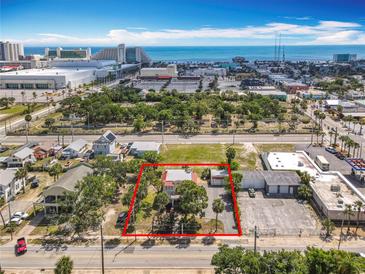 Wonderful home boasting lush landscaping and is near the beach and shopping at 20 N Halifax Ave, Daytona Beach, FL 32118