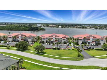 Spacious condos with water view, lush landscaping, and convenient parking at 454 Bouchelle Dr # 102, New Smyrna Beach, FL 32169