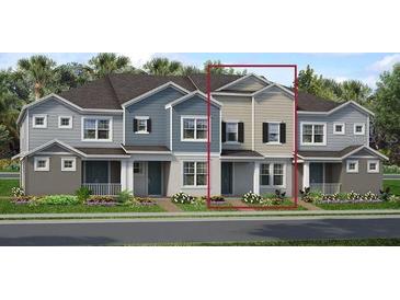 Charming two-story townhome featuring a welcoming entrance and well-manicured landscaping at 1463 Alston Bay Blvd, Apopka, FL 32703