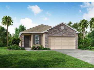 One-story home with stone accents and a two-car garage at 5599 Maddie Dr, Haines City, FL 33845