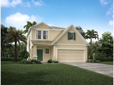 Charming two-story home with manicured lawn, two-car garage, and lush landscaping at 2755 San Marco Way, Winter Haven, FL 33884