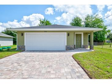 Charming single-story home with a brick paver driveway and an attached one-car garage at 2240 Center St, Sanford, FL 32771