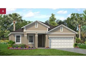 Charming single-story home features a two-car garage, manicured lawn, and blossoming flower beds at 2280 Sirena Ln, Mount Dora, FL 32757
