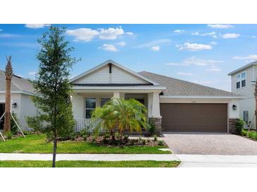 Charming single-story home with manicured lawn and attached two-car garage at 5267 Stone Ridge Pl, St Cloud, FL 34771