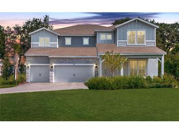 Charming two-story home featuring a well-manicured lawn and a three-car garage, perfect for Gathering living at 708 Fox Edge Ct, Oviedo, FL 32765