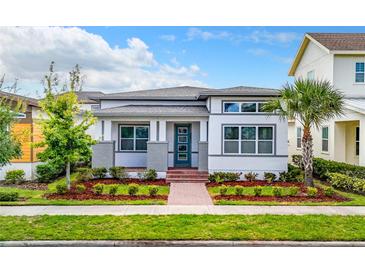 Charming single-story home featuring a neatly landscaped front yard and inviting brick pathway at 8851 Sperry St, Orlando, FL 32827