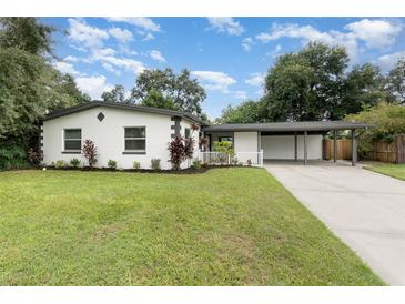 Charming single-story home with well-maintained landscaping and a covered carport at 2524 Dellwood Dr, Orlando, FL 32806