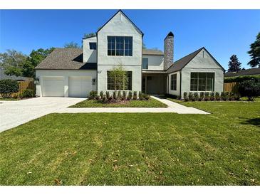 Attractive two-story home showcasing modern architectural design, beautiful landscaping and large windows at 1730 Winchester Dr, Winter Park, FL 32789