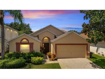 Inviting single-Gathering home with a well-manicured lawn and a two-car garage at 16608 Rising Star Dr, Clermont, FL 34714
