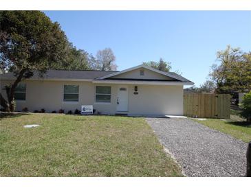 Charming single-story home with a well-maintained lawn and newly graveled driveway at 511 Reed Ne Ave, Oviedo, FL 32765