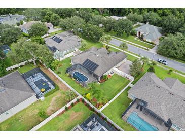 Aerial view of home, pool, and surrounding neighborhood at 2708 Ponkan Meadow Dr, Apopka, FL 32712