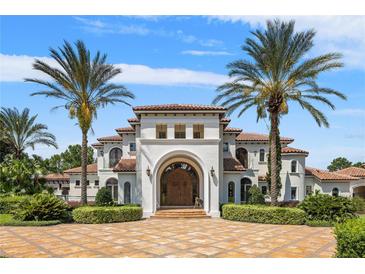 Impressive two-story home with tile roof and arched entryway at 1965 Lake Markham Preserve Trl, Sanford, FL 32771