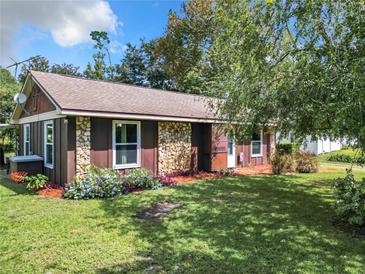 Charming ranch home with stone accents and landscaped yard at 290 Valencia Rd, Debary, FL 32713