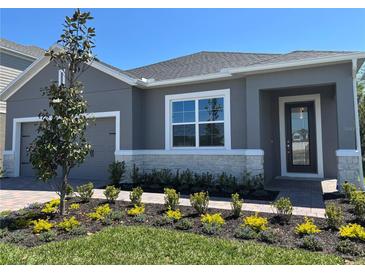 Charming single-Gathering home with a well-maintained front yard and gray exterior at 1173 Basalt Ln, Sanford, FL 32771