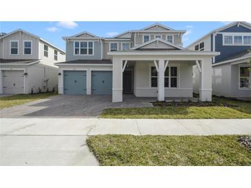 Charming two-story home featuring a covered entry, two-car garage, and well-maintained landscaping at 259 Severn Way # 38, Orlando, FL 32803