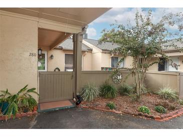 Inviting front entrance featuring a charming garden and private courtyard at 280 Windmeadows St, Altamonte Springs, FL 32701