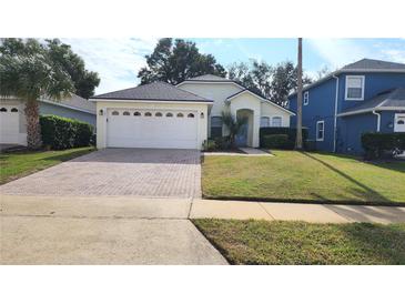 One-story house with attached garage and well-manicured lawn at 105 Fern Springs St, Debary, FL 32713