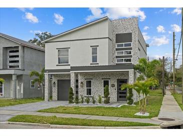 Beautifully designed two-story home with modern architectural details and landscaped front yard at 801 W Anderson St, Orlando, FL 32805