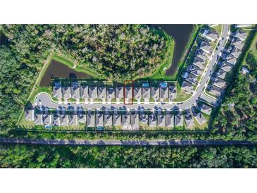 Stunning aerial view of a neighborhood featuring well-maintained homes and lush greenery at 5648 Green Arrow Pl, Sanford, FL 32773