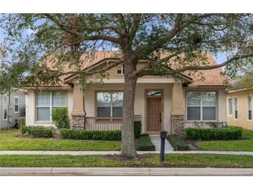 Craftsman style home with a brown door and stone accents at 12953 Runswick Ave, Windermere, FL 34786