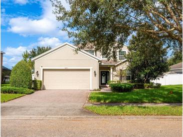 Two-story house with attached garage and landscaped lawn at 1601 Blue Grass Blvd, Deland, FL 32724