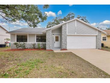 Updated one-story home with new paint and landscaping at 3629 Peaceful Pl, Orlando, FL 32810