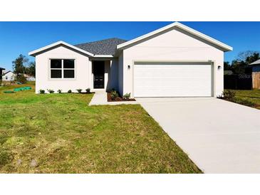 New construction home with attached garage and front yard at 3180 Riverhead Dr, Deltona, FL 32738