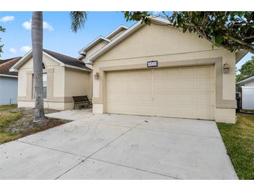 Lovely home with a two-car garage and well-maintained landscaping at 4925 Cedarstone Ln, Orlando, FL 32822