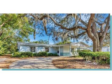 Charming single-story home with mature trees, lush landscaping and inviting curb appeal at 707 Beverly Ave, Altamonte Springs, FL 32701