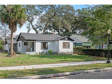 Charming bungalow with a newly painted exterior and landscaped lawn at 400 Raehn St, Orlando, FL 32806