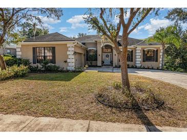 Beautiful two-story home with a landscaped yard and attached garage at 6689 Bell Glade Pl, Sanford, FL 32771