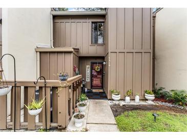 Inviting exterior with landscaped walkway and charming entryway at 5316 Pebble Beach Dr # E, Orlando, FL 32811