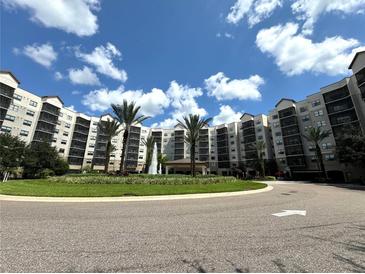 Resort-style community with fountain and palm trees at 14501 Grove Resort Ave # 3640, Winter Garden, FL 34787