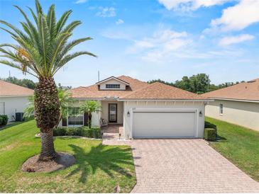 Charming single-story home featuring a well-maintained lawn and a spacious two-car garage at 4112 Aberdeen Ln, Lake Wales, FL 33859