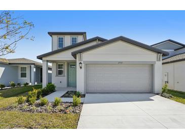 Charming two-story home featuring a two-car garage and manicured landscaping at 2735 Virginia Pine Dr, Bartow, FL 33830