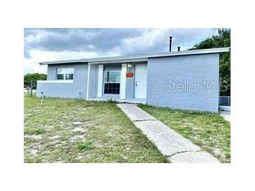 Charming single-story home with a well-maintained lawn and inviting entrance at 2302 E Dana Dr, Deltona, FL 32738