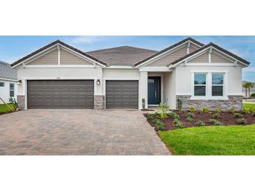 Charming single-story home with a two-car garage and well-maintained landscaping at 2990 Arranmore Dr, Ormond Beach, FL 32174