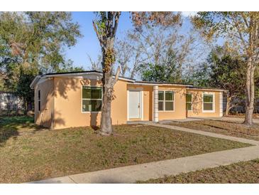 Single-story home with a well-maintained lawn and a concrete pathway to the front door at 2341 Hadley St, Deltona, FL 32738