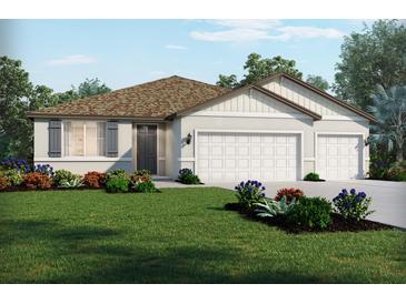 Beautiful home with three-car garage and lush landscaping at 2332 Citrus Bloom Dr, Bartow, FL 33830