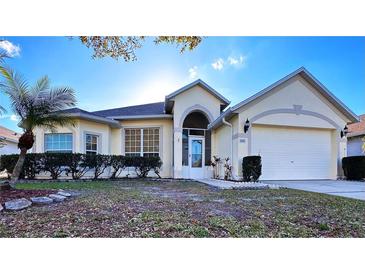 Attractive single-story home with a two-car garage and well-manicured lawn at 2485 Huron Cir, Kissimmee, FL 34746