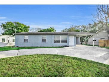 Newly painted 1 story home with a carport and landscaped lawn at 842 E Church Ave, Longwood, FL 32750